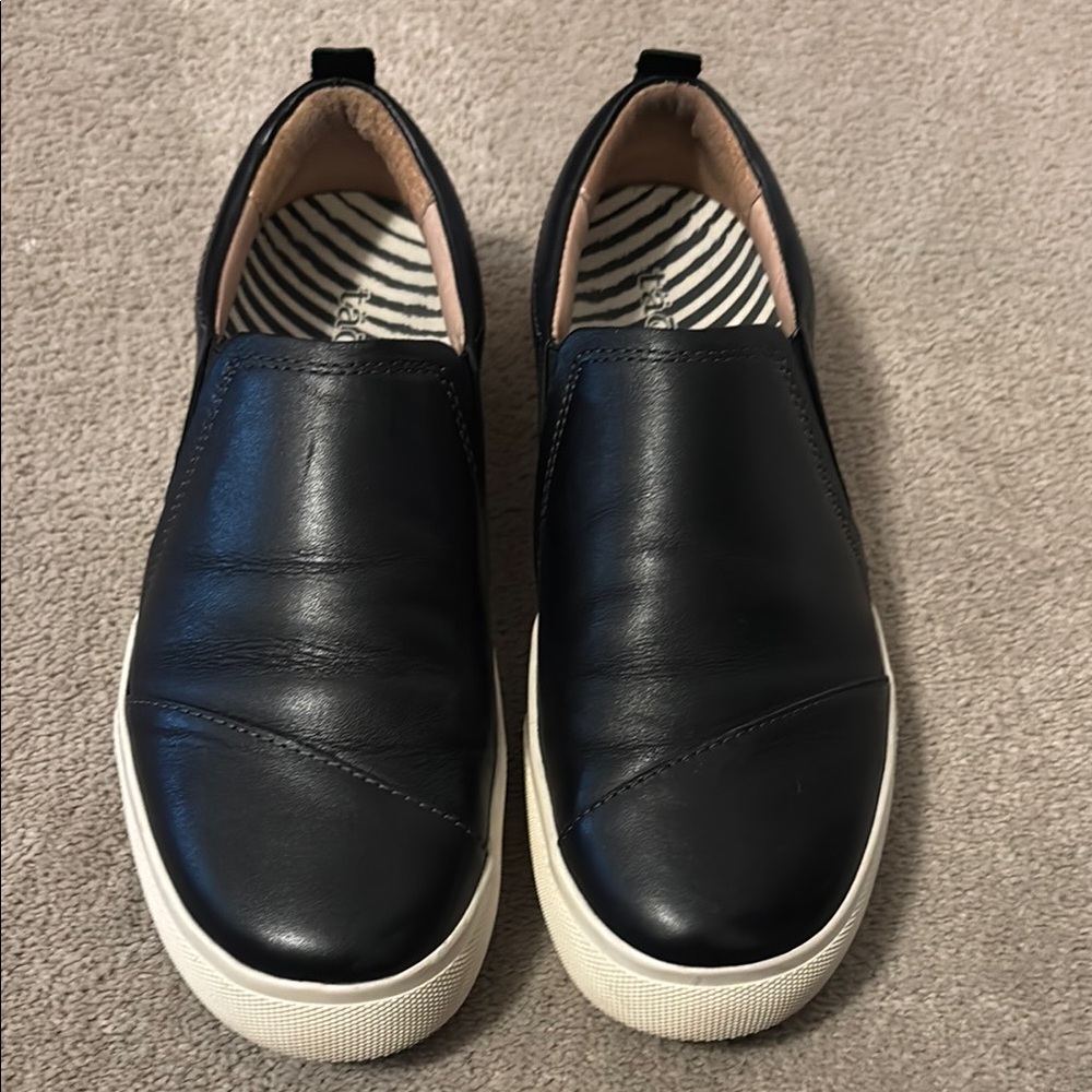 Taos Footwear Black and White Slip-On Sneakers